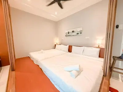 a bedroom with a large white bed with white pillows at Fairy 2 Pool Villa Ipoh 26 Pax Kbox Snooker Lego in Ipoh