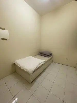 a small bedroom with a bed in the corner at Teratai Bunda Homestay Tambun in Tambun