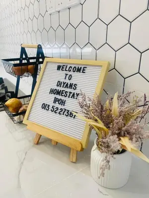 a sign that says welcome to drinks houseparty for us special at Diyans Homestay Ipoh in Ipoh