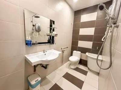 a bathroom with a sink and a toilet at Capybara Kids House 12 Pax 5 min to Ipoh Town in Ipoh