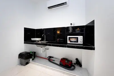 a kitchen with a counter with a microwave on it at Casa Bella - Private Studio Ipoh - Pet allowed in Ipoh