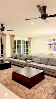 a living room with a couch and a table at Riverview Bungalow in Cameron Highlands in Tanah Rata