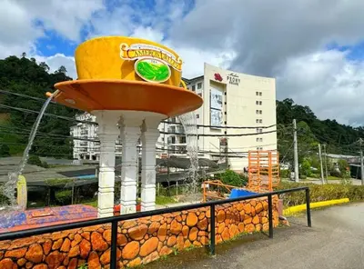 a drink fountain in front of a building at Riverview Bungalow in Cameron Highlands in Tanah Rata