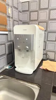 a microwave sitting on a counter next to a sink at Mk homestay butterworth in Butterworth