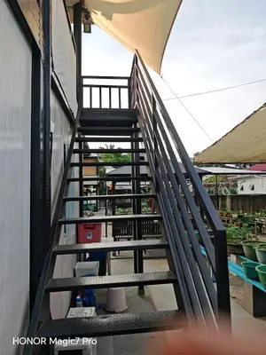 a set of stairs leading up to a building at deLotus Villa in Simpang