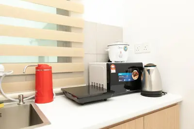 a coffee maker on a counter in a kitchen at Meritus Residensi Seaview Pent Hauz 3BR 10Pax in Perai