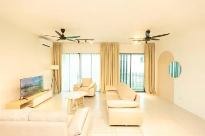 a living room with white furniture and large windows at Meritus Residensi Seaview Pent Hauz 3BR 10Pax in Perai