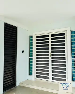 a room with two windows with blinds at Homestay AZ Kulim in Kulim