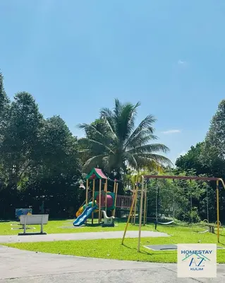 a park with a playground with a slide at Homestay AZ Kulim in Kulim