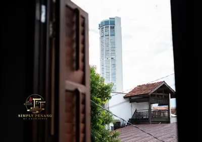a tall building in the distance with a building at Lumut Heritage - a walk to Armenian St Art & Cafes in George Town