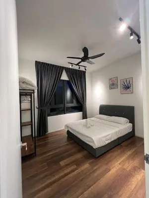 a bedroom with a bed and a ceiling fan at Sunway Onsen 4-6pax in Kampong Batu Lapan