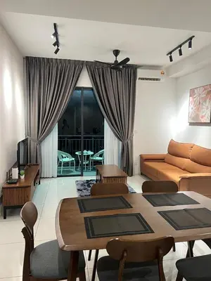 a living room with a couch and a table at Sunway Onsen Cozy view 4-6pax in Kampong Batu Lapan