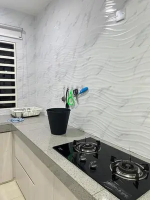 a kitchen with a black stove top in a counter at BungalowD Pool Villa 7R6B with Netflix Enjoyable Movies & Dramas in Ipoh