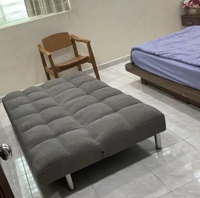 a bed and a chair in a bedroom at \u60a6\u5ba2YK Homestay 5mins to IconCity in Bukit Mertajam