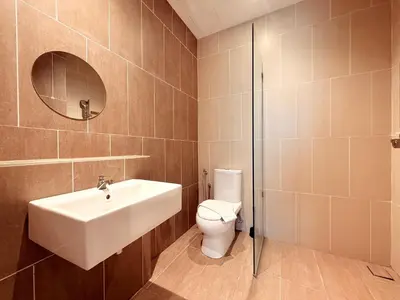 a bathroom with a sink and a toilet at Iconic Regency Seaview Homestay with Rooftop Pool in Bayan Lepas