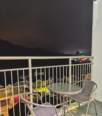 a balcony with a table and chairs on a balcony at Bukit Urbane Night Market CH in Brinchang
