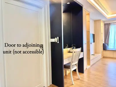 a room with a door to a dining room with a table at Tropicana 218 Macalister #LuxuryFrenchVintage #InfinityPool #Studio2pax #Quality well maintained #Private host in George Town