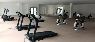 a gym with several tread machines in a room at Ipoh Homestay at Anderson - 2 Room 2 Bathroom -Maximum 6 pax --Self Check In-- in Ipoh