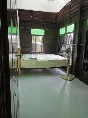 a hospital room with a bed and a fan at Teratak Taha in Kepala Batas