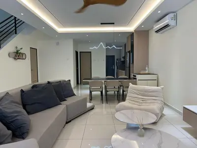 a living room with a couch and a table at Karaoke Cozy Landed Home at Sutera n Paradign for 10pax in Gua Sai