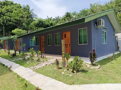 a row of houses with plants in front of them at Ulu River Lodge, Riverbug Perak in Gopeng
