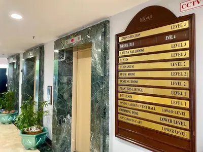 a sign on the wall of a hotel lobby at Maisie Rainbow Penang in Tanjung Bungah