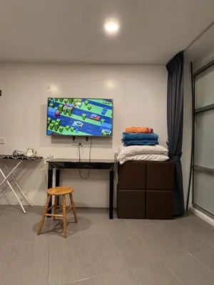 a room with a desk with a tv on a wall at THE CEO 3 BEDROOM near USM SPICE ARENA PANTAI SPECIALIST AIRPORT in Bayan Lepas