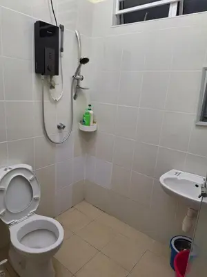 a bathroom with a shower and a toilet and a sink at BC homestay at Alma Indah in Bukit Mertajam
