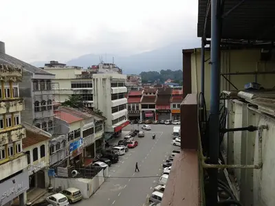a view of a city street with cars and buildings at HotelMalaya in Taiping