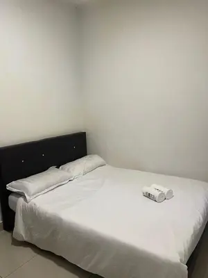 a bed with two white pillows on top of it at Ereens homestay 3 Palas horizon in Cameron Highlands