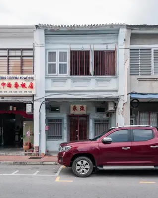 a red suv parked in front of a building at Ah Tong Residence - 3 mins to Kimberley Night Market in George Town
