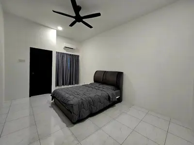 a bedroom with a bed and a ceiling fan at The Cozy 88 ipoh in Ipoh