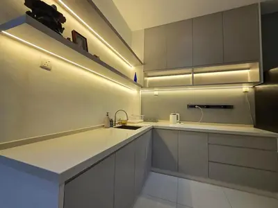 a kitchen with white cabinets and a sink at The Cozy 88 ipoh & in Ipoh