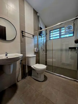 a bathroom with a toilet and a sink and a shower at The Cozy 88 ipoh & in Ipoh
