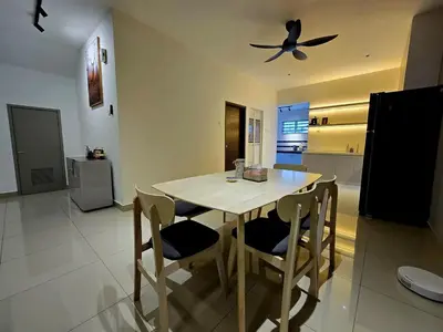 a kitchen with a table and chairs and a ceiling fan at The Cozy 88 ipoh & in Ipoh