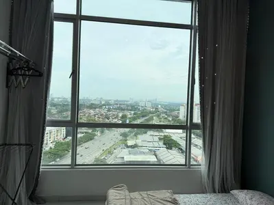 a large window with a view of a city at Perffect JB view Paradigm UTM in Gua Sai