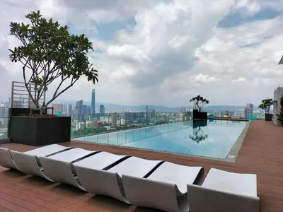 a swimming pool on the roof of a building at Cozy Studio I Riveria City I 1km to KL Sentral in Gua Sai