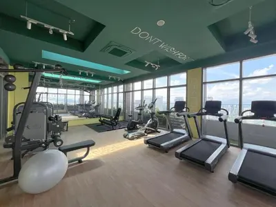 a gym with treadmills and exercise equipment in a building at Cozy Studio I Riveria City I 1km to KL Sentral in Gua Sai