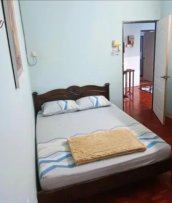 a bedroom with a bed with a towel on it at Mairahomestay Tambun Islam Only in Tambun