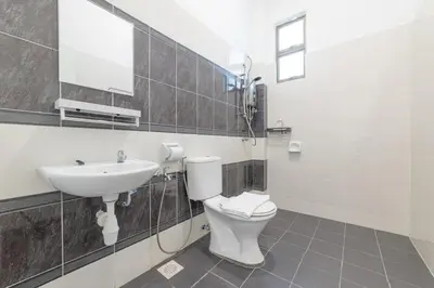 a bathroom with a toilet and a sink at 7 \u53f7 Kota Cozy Homestay 3 storey 22pax-7 Room-SingK in Gua Sai