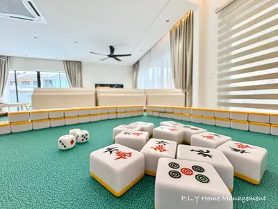 a room with poker chips and dice on the floor at HH Villa Private Pool Bercham Ipoh in Ipoh
