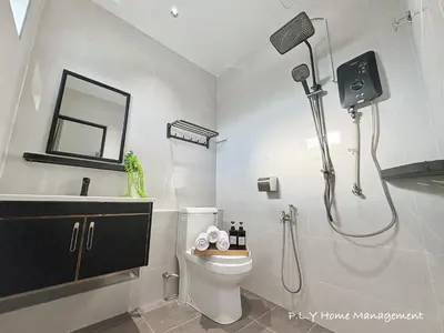 a bathroom with a shower and a toilet and a sink at HH Villa Private Pool Bercham Ipoh in Ipoh