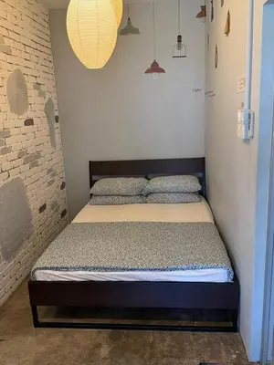 a bedroom with a bed in a small room at HuttonSTAY at Georgetown in George Town