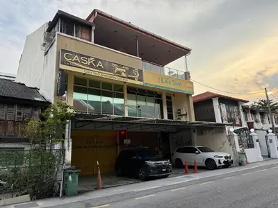 a building with a car parked in front of it at HuttonSTAY at Georgetown in George Town