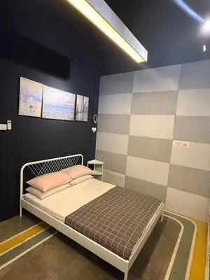 a bedroom with a bed in a room at HuttonSTAY at Georgetown in George Town