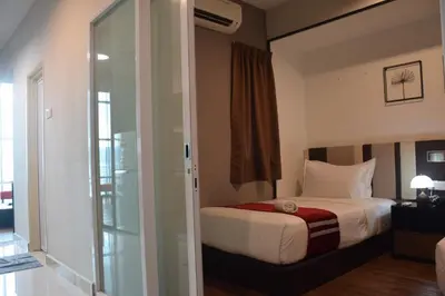 a bedroom with a bed and a sliding glass door at Maritime Suite by Ocean Luxe 2BR Seaview Dryer Water Dispenser in George Town
