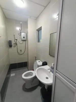 a bathroom with a toilet and a sink at Dream 7 at Emerald avenue in Brinchang