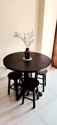 a black table with a vase on top of it at #MyUrbanGetaway at CameronFair, Cameron Highlands in Tanah Rata