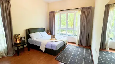 a bedroom with a bed and a large window at The Haven Lakeside Residences, Lake View Suite IPOH in Gua Sai