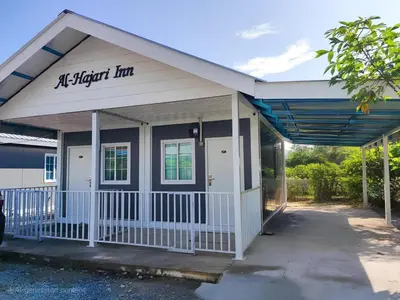 an exterior view of an air higher inn building at al Hajari Inn - For Islam Only - Kg Banggol Batu Lenggong in Kampong Banggol Belimbing